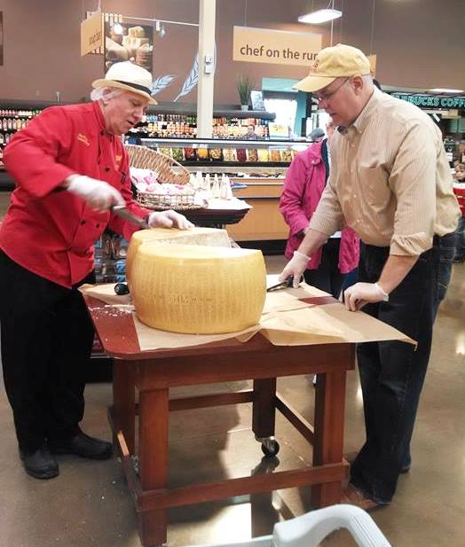 Ray Powell, who has anchored the Murray's cheese shop at Kroger, is shown with Jim and Julie of Q102 last year.